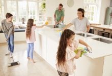 Family cleaning the kitchen together