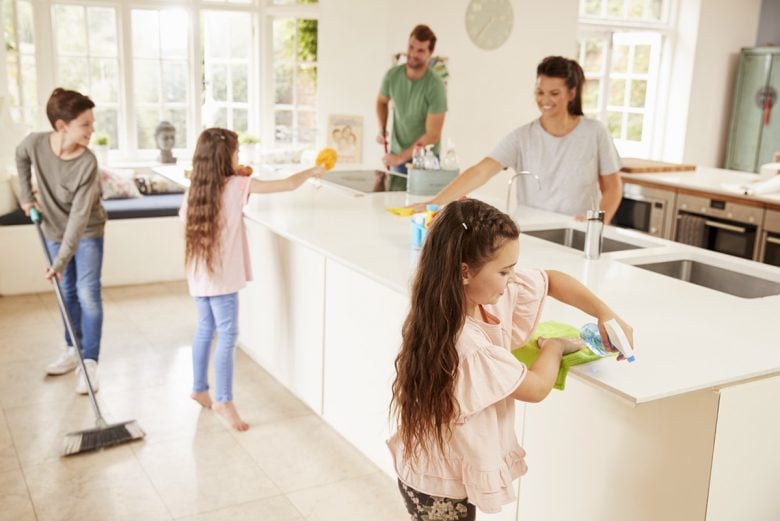 Family cleaning the kitchen together