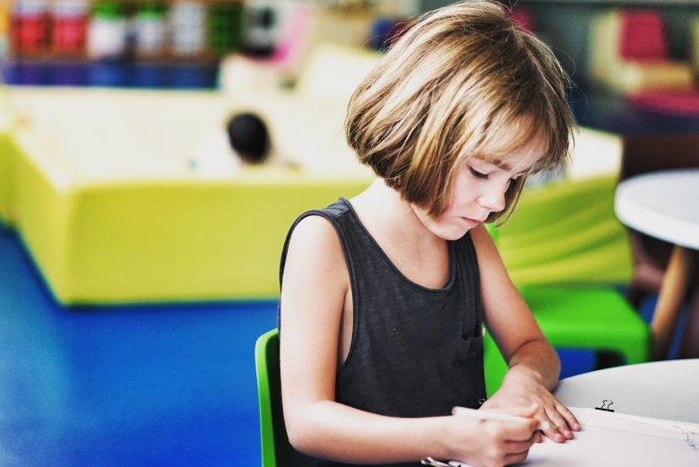 child sitting at desk