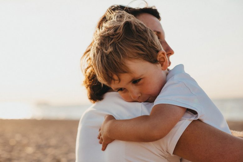 A parent comforting a child