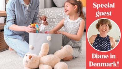 Child and Parent Cleaning up Toys